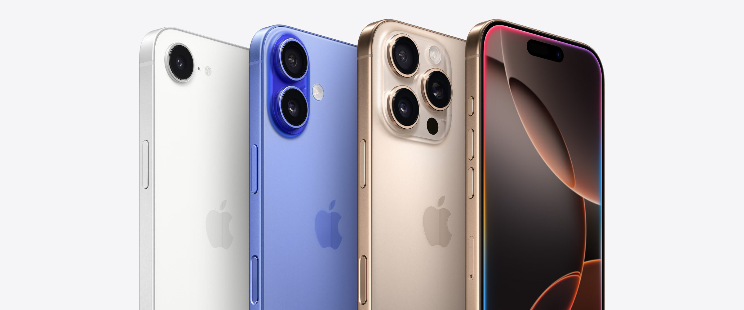 Four iPhone devices, including two iPhone 16 Pro models in Desert Titanium, one showing three camera lenses behind the other iPhone 16 Pro showing Dynamic Island. Next to an iPhone 16 model in Ultramarine showing two camera lenses and an iPhone 16e model in White showing one camera lens.