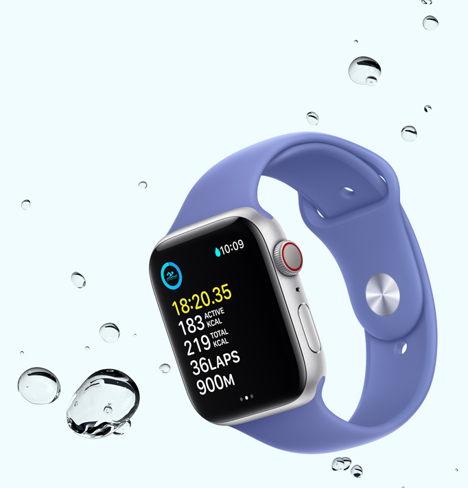 Apple Watch SE displaying a swim workout screen with water droplets near the device