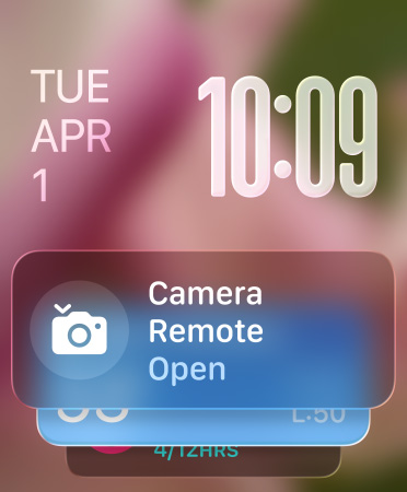 Remote Camera widget appears at bottom of screen, translucent time numerals at top right, date at top left