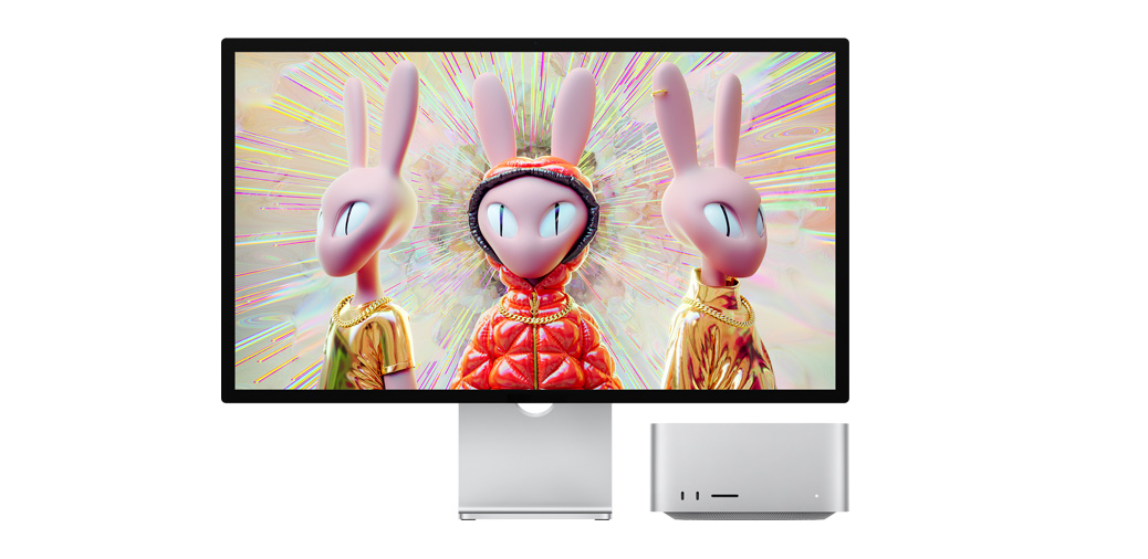 Mac Studio 旁的 Studio Display 顯示人形兔子角色的 3D 影像。