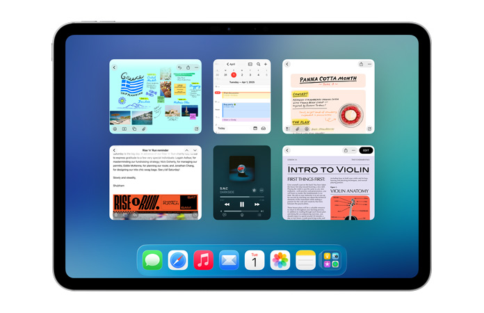 iPad, nằm ngang, màn hình hiển thị sáu cửa sổ mở thành hai hàng, bao gồm ứng dụng Lịch, ứng dụng Ghi Chú, Apple Music, và Safari