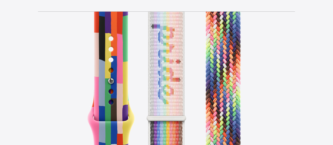Pride Edition Sport Band, six stripes made of numerous thin rectangles in solid rainbow hues and other colors, slightly uneven edges, smooth fluoroelastomer, pin-and-tuck closure, Pride Edition Sport Loop, features a hook-and-loop fastener, with the word pride woven into the fabric, Pride Edition Braided Solo Loop band, woven in a neon array of colors inspired by the vibrant rainbow Pride flag